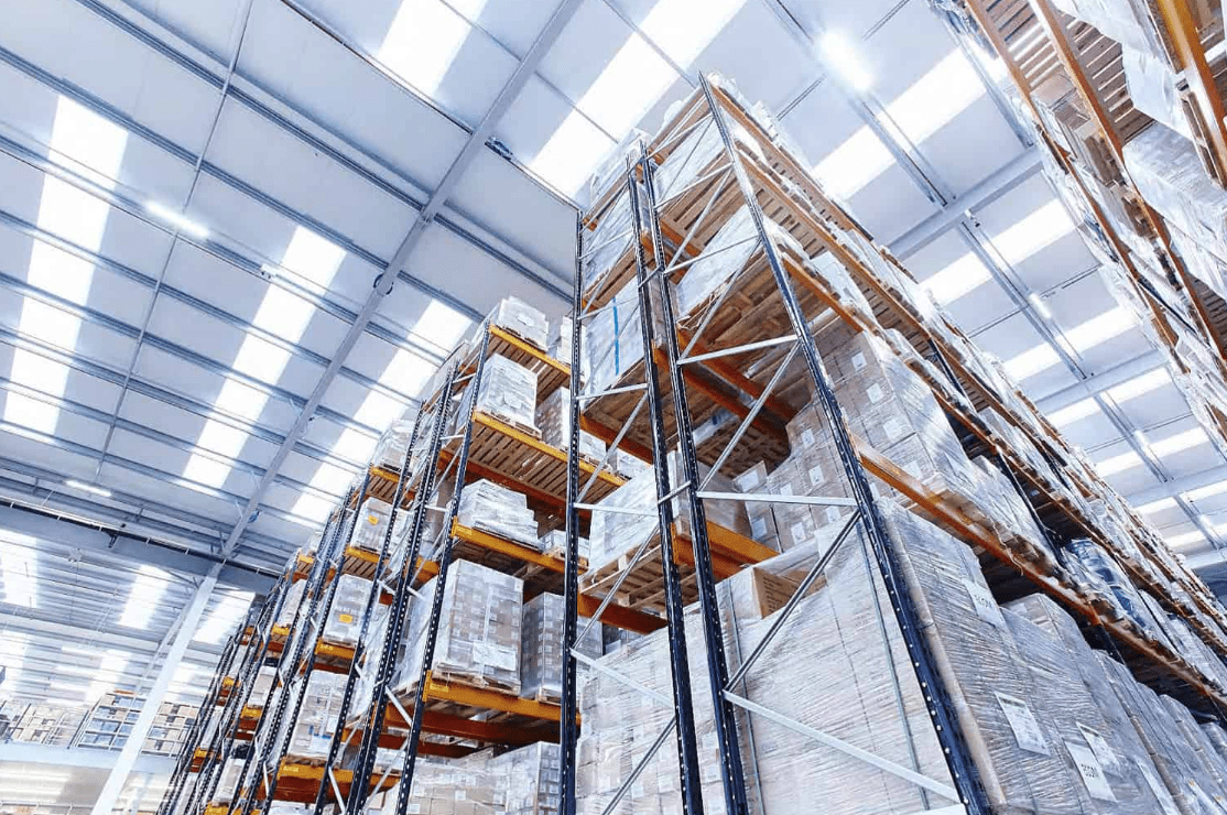 Warehouse shelves stacked with various boxes