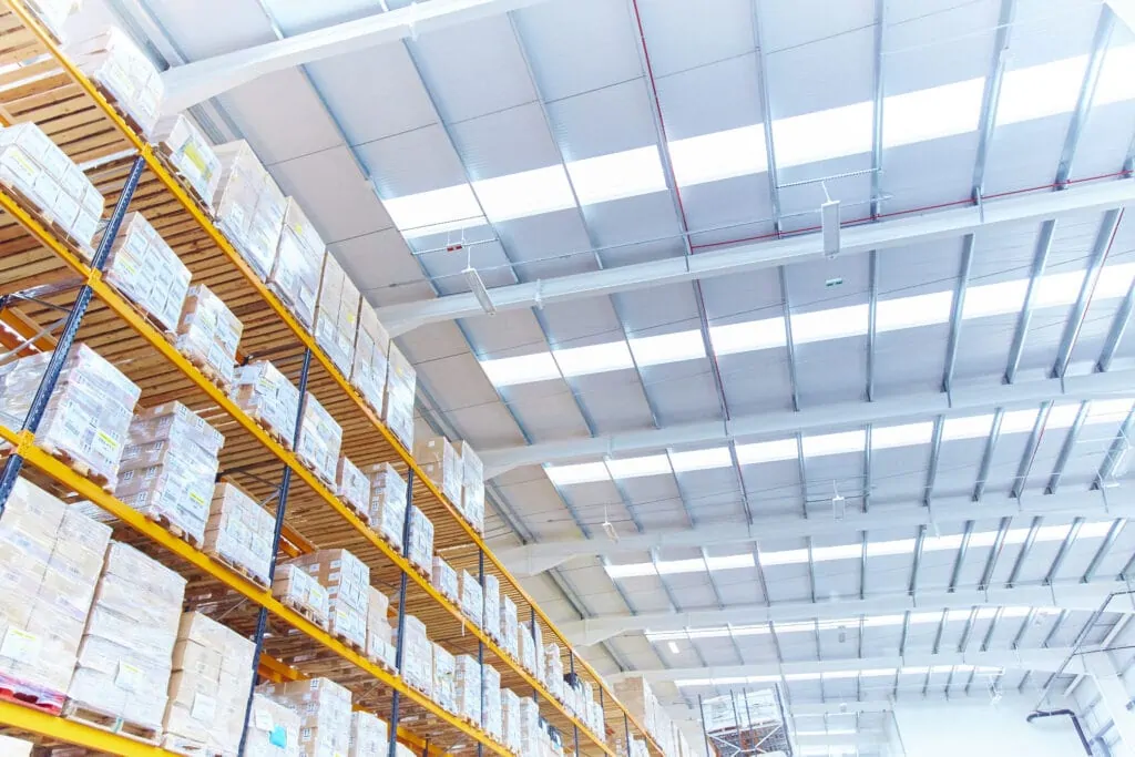 Warehouse shelves with stock organised in boxes