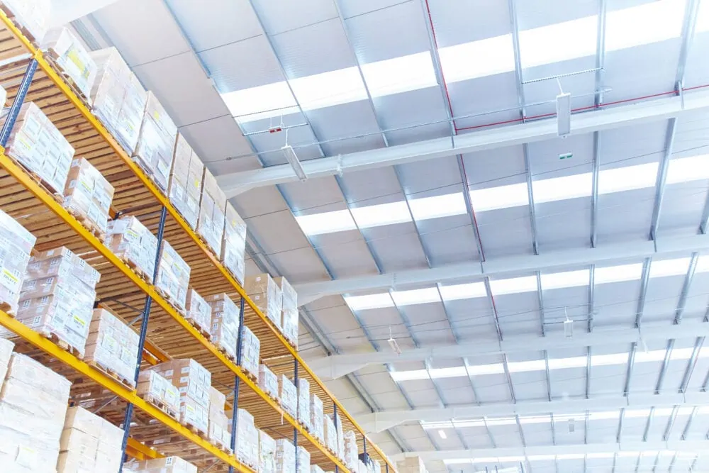 Warehouse shelves with stock organised in boxes